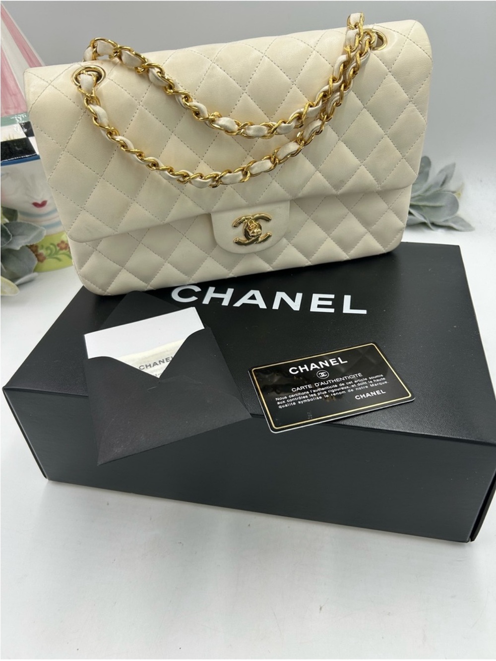 Women’s Chanel quilted shoulder bag in ivory with gold hardware made in France